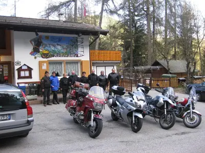 a group of motorcycles parked in front of a building at Albergo Pineta in Castello di Fiemme