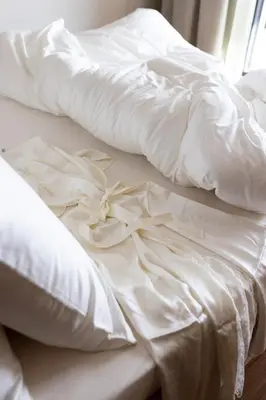 two white beds sitting next to each other at Culinaria living in Tirolo