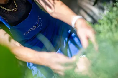 a man wearing a blue shirt with his arms outstretched at Marolhof in Cornaiano