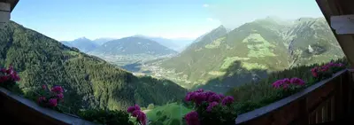 a view of a mountain valley with purple flowers at Ferienwohnung Boarbichlhof in Schenna
