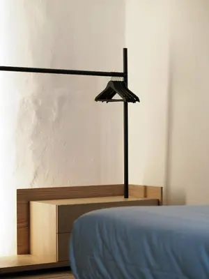a bedroom with a bed and a desk at Marktplatz 10 in Caldaro