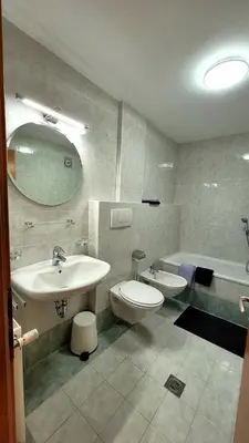 a bathroom with a sink and a toilet and a tub at Apartment Frisch in San Lorenzo di Sebato