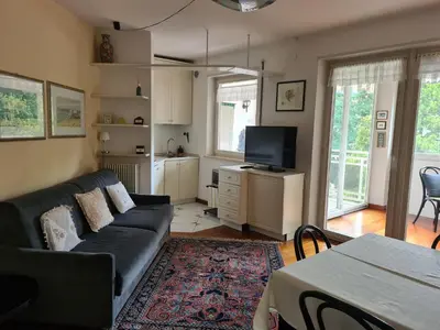 a living room with a couch and a tv at Villa Doris in Merano