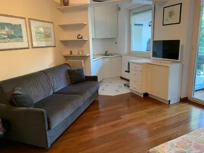 a living room with a couch and a flat screen tv at Villa Doris in Merano