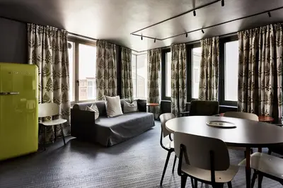 a living room with a couch and a table at Bettstadt Apartments in Vipiteno