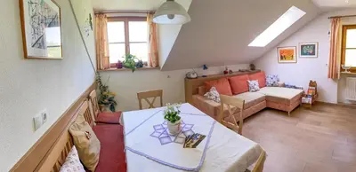 a living room with a couch and a table at Kuenhof in San Sigismondo
