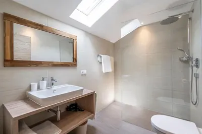 a bathroom with a sink and a shower at Residence Alpina in Tesimo