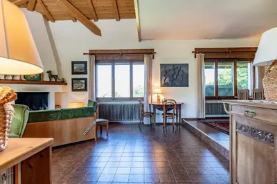 a living room with a couch and a table at Dolomites White Rest - Mountain View in Tres