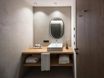 a bathroom with a sink and a mirror at Arieshof in Floronzo