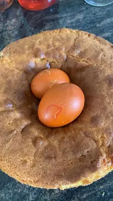 two tomatoes are sitting on top of a pie at Hotel Zima in Merano