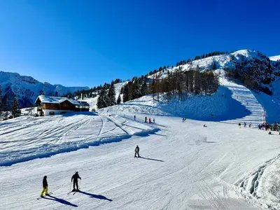 a group of people skiing down a snow covered slope at Casa Scardanzan in Canale dʼAgordo