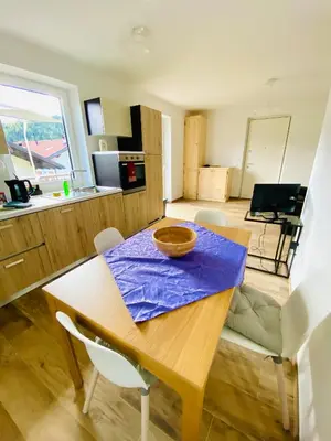 a kitchen with a wooden table with a bowl on it at Casa Scardanzan in Canale dʼAgordo