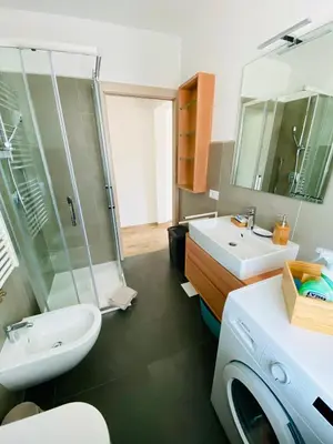 a bathroom with a sink and a toilet and a shower at Casa Scardanzan in Canale dʼAgordo