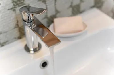 a bathroom sink with a chrome water faucet at Transmontana in Vols am Schlern