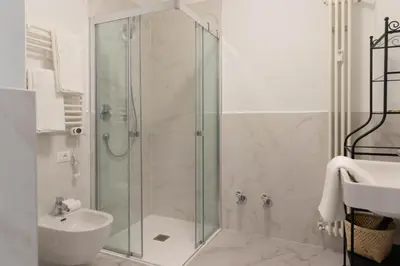 a bathroom with a shower and a sink at Apartments Iris in Merano