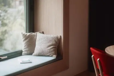 a pillow is sitting on a window sill at Der Mittermoar in Bressanone