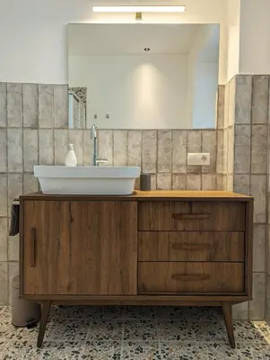 a bathroom with a sink and a mirror at Gasthof Eggwirt in Ultimo