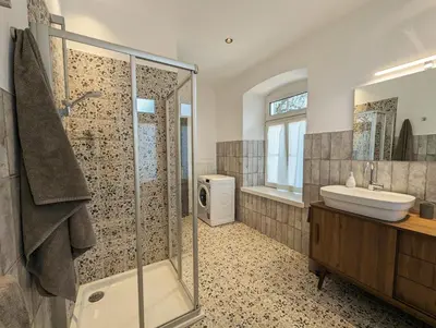 a bathroom with a shower and a sink at Gasthof Eggwirt in Ultimo