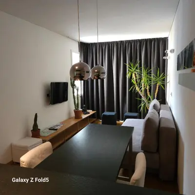 a living room with a couch and a table at Ka.La Apartment in Bolzano