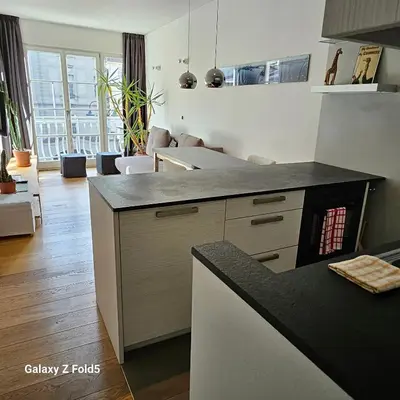 a kitchen with a counter and a stove top oven at Ka.La Apartment in Bolzano