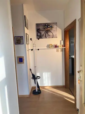 a room with a bike on the wall next to a door at Apt. BELLA VISTA nel Cuore della Valle di Cembra. in Segonzano