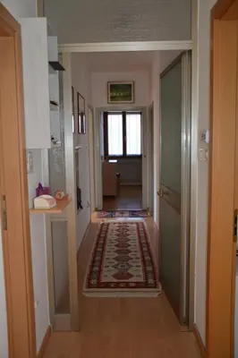 a hallway of a home with a rug on the floor at Apt. BELLA VISTA nel Cuore della Valle di Cembra. in Segonzano