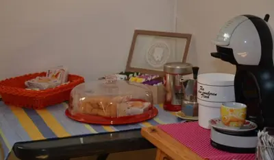 a kitchen counter with a table with a blender and food at Apt. BELLA VISTA nel Cuore della Valle di Cembra. in Segonzano