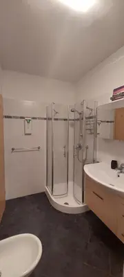 a bathroom with a shower and a sink at ROCCO's APARTMENT - in centro a Merano in Merano
