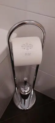 a roll of toilet paper on a holder in a bathroom at ROCCO's APARTMENT - in centro a Merano in Merano