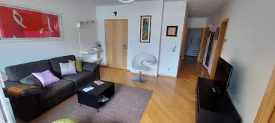 a living room with a couch and a table at ROCCO's APARTMENT - in centro a Merano in Merano