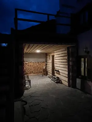 a night view of a building with a patio at Conte Moro, ospitalità in Vanoi in Canale San Bovo