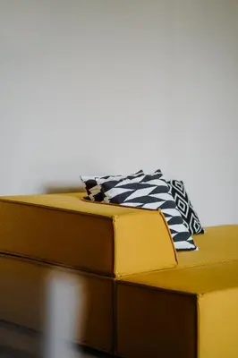 a stack of books with a tie on top of them at La Loggia Georg in Pianizza di Sopra