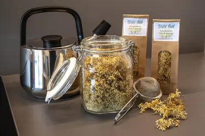 a jar of seeds sitting on a table with a container of spices at Stillehof - Ferienwohnungen auf dem Bauernhof- Südtirol in Bressanone