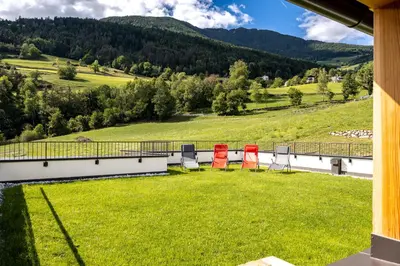 a balcony with chairs and a view of a mountain at Stillehof - Ferienwohnungen auf dem Bauernhof- Südtirol in Bressanone