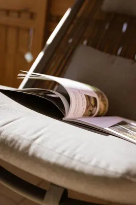 an open book sitting on top of a bed at Residence Walchhof in Schenna
