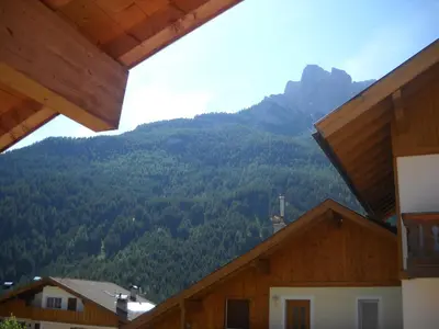 a view of a mountain from a house at Villetta Enrosadira in Vigo di Fassa