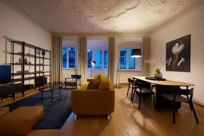 a living room with a couch and a table at Argentieri Apartment in Bolzano