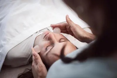 a woman laying in a bed getting a massage at Relais & Chateaux Hotel Castel Fragsburg in Merano