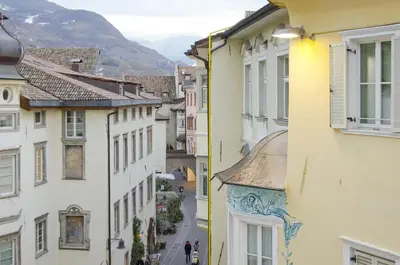 a view of a street in a city with buildings at Green Apartment in Bolzano
