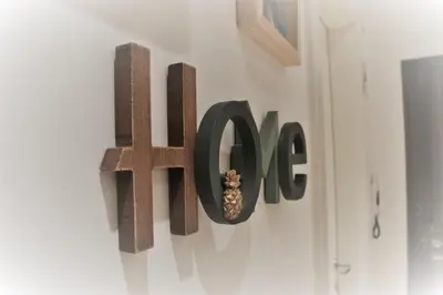 a sign on a wall with the word farma at Green Apartment in Bolzano
