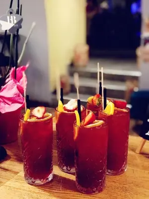 a group of four drinks in cups on a table at Green Apartment in Bolzano