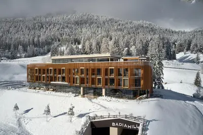a building on top of a snow covered mountain at Badia Hill in Badia