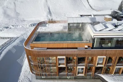 a building with a hot tub in the snow at Badia Hill in Badia
