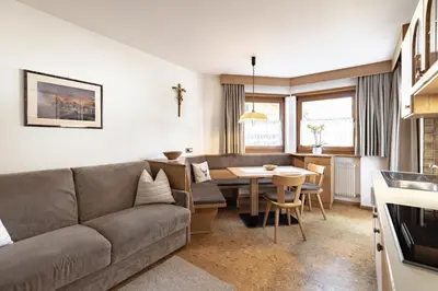 a living room with a couch and a table at Apartment Ruiel in Santa Cristina in Val Gardena