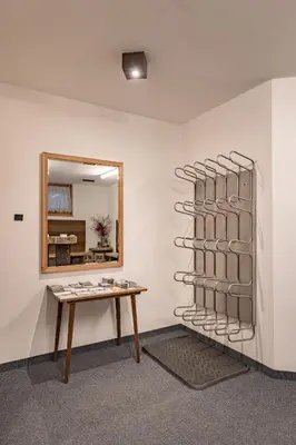a room with a table and a mirror at Apartment Ruiel in Santa Cristina in Val Gardena