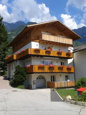 a large house with balconies on the side of it at Appartments Stoanegg in Parcines