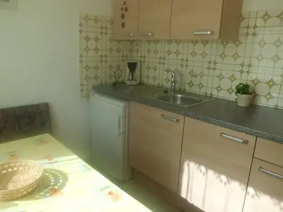 a kitchen with a sink and a counter top at Appartments Stoanegg in Parcines