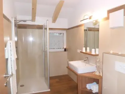 a bathroom with a shower and a sink at Appartments Stoanegg in Parcines