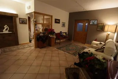 a living room with a couch and a table at Garni Miravalle in Moena