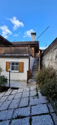 a living room with a couch and a chair at Chalet Decrestina in Campitello di Fassa